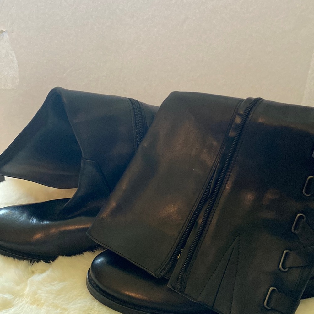 Knee high boots by Arturo Chiang